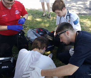 Paramedic students assess a patient during Hutchinson Field Ops program. (Image courtesy Facebook Kingman EMS)
