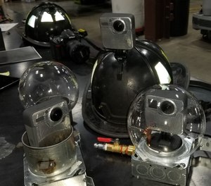 Critical and generous donations from GoPro, Inc., in the form of 360 video cameras, pictured with air-cooled enclosures, for acquired structure live burns. The videos focused on fire behavior, forceable entry, ventilation, and size-up, each evaluated in synchronized VR training.