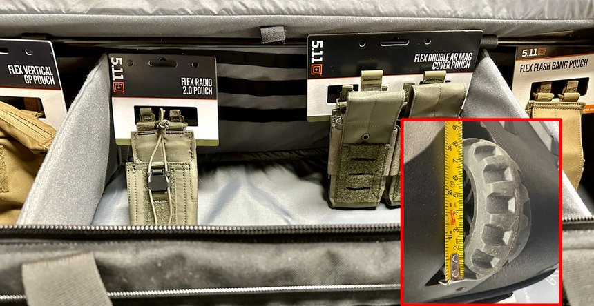Velcro-topped MOLLE and two movable dividers let you throw a lot of stuff into the bag without it shifting. Note the large wheels for stability.