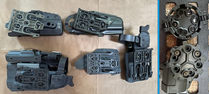 Figure 2: The Safariland QLS allows me to swap holsters in seconds. The holster at the bottom left has a tourniquet mounted on the front. To the right is the Blackhawk quick disconnect system. While the gear shape allows you to change your holster’s cant on the fly, it requires fine motor skills to mount and unmount and might not be the best choice for your SHTF belt.