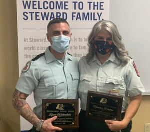 Acadian Ambulance EMT Ryan Wilkenfeld and Paramedic Heather Waites received the agency's Distinguished Service Award for rescuing six people, including a newborn who needed to be resuscitated, after witnessing a major rollover crash in February.