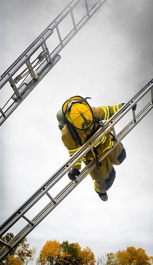 Firefighter doing a ladder slide (Photo/Pixabay)