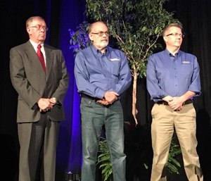 Jack Stout (center) and Todd Stout Founder (right), President of FirstWatch present an award at Pinnacle EMS 2018 to Jon Swanson.