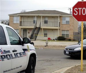 Killeen police investigate the death of a Fort Hood soldier who was found dead at his Killeen, Texas home on Tuesday, Jan. 13, 2015. The first of two Ebola tests given as a precaution came back negative. He had returned from deployment in West Africa. (AP Photo/The Killeen Daily Herald, Eric J. Shelton)
