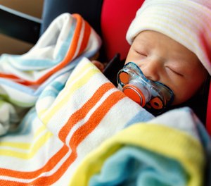 Just like it’s illegal to hold onto children and infants in your personal vehicle while it’s traveling, the same holds suit in the back of an ambulance.