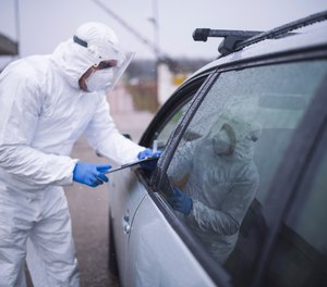 Full PPE (gown, gloves, surgical mask and eyewear) should be worn when working with suspected or confirmed COVID-19 patients.