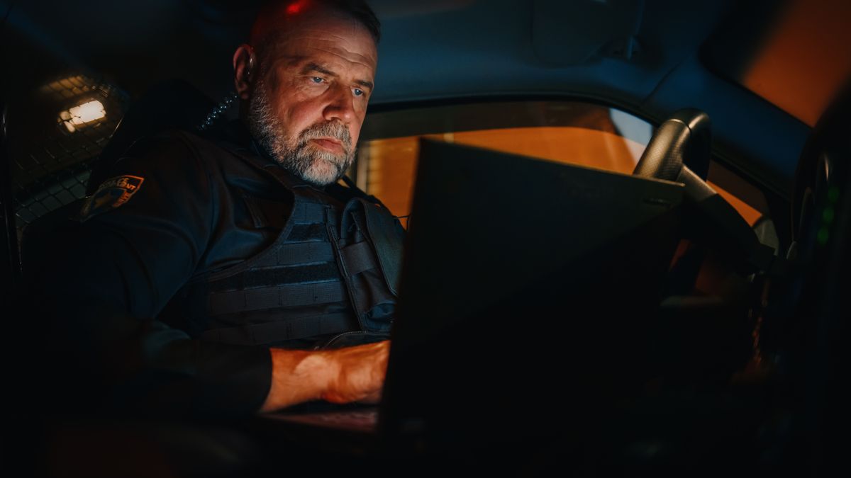 The elder officer personifies sound judgment and a hard-won perspective in a chaotic career field, a composed presence showing newer officers that they don’t have to learn their jobs by making every mistake in person.