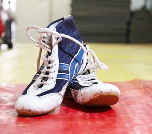 Wrestling shoes are an item most police recruits may discard or leave behind on graduation day.