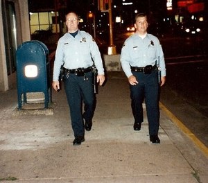 The late officer Jeff Graves and his son officer Heath Graves of the La Crosse Police Department walking the beat.