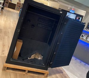 Firefighters used hydraulic extrication tools to free a 15-year-old girl from a locked gun safe in a gun store showroom Tuesday.