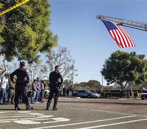 Downey police officers and city employees line up to pay their respects.