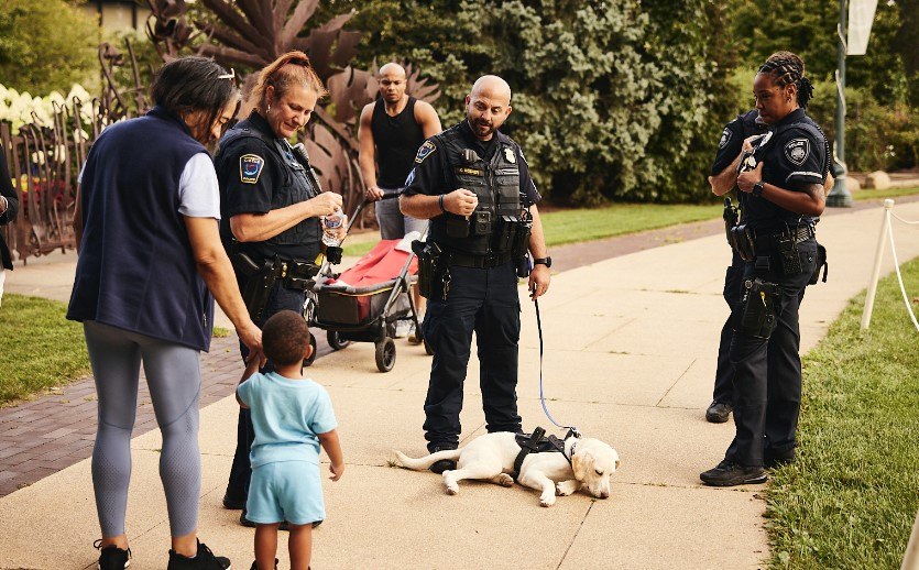 The University Circle Police Department places a strong focus on community policing. Here the agency's new therapy dog meets with a young member of the community.