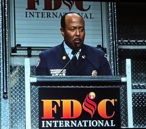 Indianapolis Fire Department Chief Ernest Malone speaks during the opening ceremony of FDIC 2023.