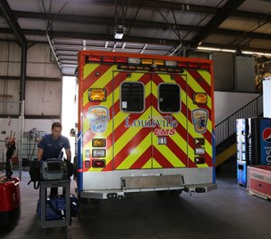 A Louisville EMS medical first responder prepares for his shift.