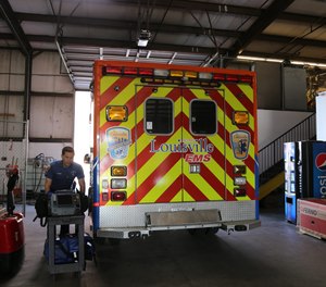 A Louisville EMS medical first responder prepares for his shift.