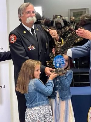 With two granddaughters at his side, Chief Goldfeder accepted the award, which recognizes leaders with exemplary impact on the national level in firefighter advocacy and fire prevention, mitigation and response.