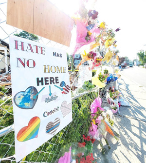 A memorial honors the victims, Ramona Cooper and David Green.