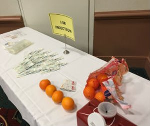 Equipment prepared for an intramuscular injection skill and competency check station