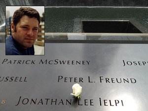 A rose has been placed on the name of FDNY Firefighter Jonathan Ielpi at the 9/11 Memorial.