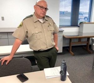 Iowa Sheriff Warren Wethington poses for a portrait at his office in Tipton, Iowa.