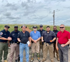 Deputies in Johnson County, Texas, pose after training on The Alternative. The department will be the first to bring the device to the field.