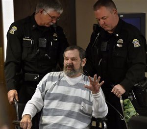 n this April 2014 , file photo, Frazier Glenn Miller Jr., is wheeled out of a Johnson County, Kan., courtroom.