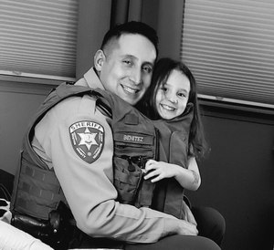 Corporal Benitez manages the stress of policing by talking with his wife, and through his family, fitness and his faith.