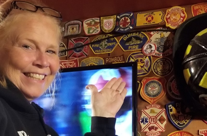 Dale's family was able to pin a tribute button on the wall behind the bar.
