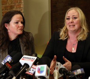 Tiffany Van Dyke, right, wife of a Chicago police officer who fatally shot teenager Laquan McDonald, speaks during a news conference Thursday, Feb. 14, 2019, in Chicago as her attorney Tammy Wendt listens. (AP Photo/Teresa Crawford)