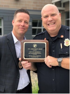 Lt. Shawn Harper and Deputy Chief Joe Bongiorno with their Association of Idaho Cities award for the ISCRS Program.