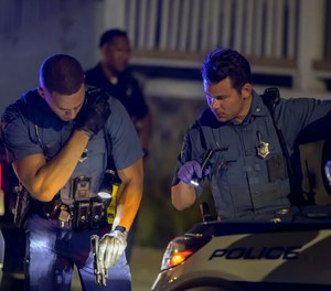 Boston Police officers, who had arrived during the traffic stop, found a gun in plain view under the driver’s seat.