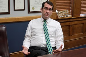 Kansas Attorney General Derek Schmidt is pushing a proposal that could prevent cities, counties and school districts from filing lawsuits against vaping companies and other big corporations. Image: AP Photo/John Hanna