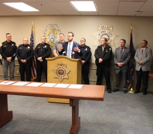 District Attorney Mike Kagay was joined by corrections and law enforcement officials who stood behind him Wednesday as he announced the formation of the Kaw Valley Anti-Human Trafficking Task Force.