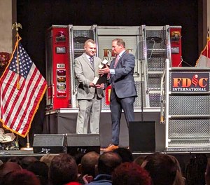 Keith Stakes receives the Fire Engineering/ISFSI George D. Post Instructor of the Year Award during FDIC 2023.