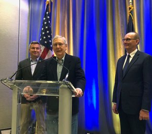 Senate Majority Leader Mitch McConnell, center, speaks to reporters on Monday, April 8, 2019, after participating in a hemp forum in Louisville, Ky. (AP Photo/Bruce Schreiner)