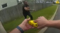 Video: Knife-wielding man grapples with officers before he's shot