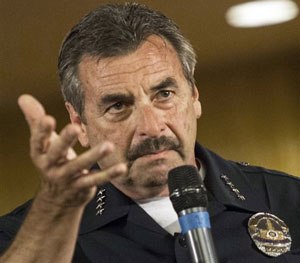 In this Aug. 19, 2014 file photo, Los Angeles Police Chief Charlie Beck takes a question at the Paradise Baptist Church in Los Angeles.