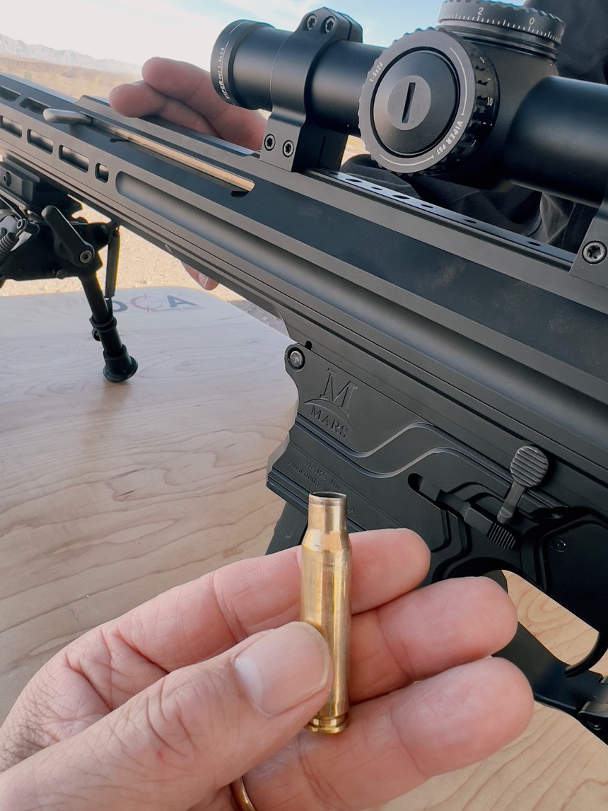 The MARS Orion is an AR-10 style rifle with a reciprocating action that pushes the barrel backward when it fires. This absorbs much of the power of the recoil, and pushes straight back, rather than causing the muzzle to rise. An unusual phenomenon from this action is almost pristine brass after firing.