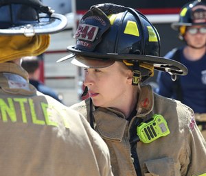 Huntley Fire Protection District firefighter/paramedic Kelly Gitzke trains with fellow fire fighters at the Huntley Fire Protection District Annex. (Photo/Antonio Perez/Chicago Tribune/TNS)
