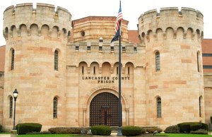 Workers are sanitizing the prison's water system, parts of which were constructed in the 1850s.