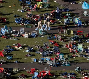In this Oct. 4, 2017, file photo, agents from the FBI process evidence at the scene of a mass shooting in Las Vegas.