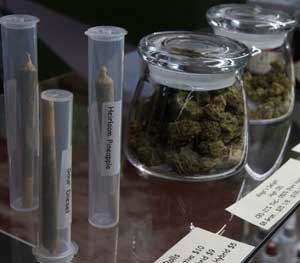 Marijuana products, including pre-rolled cigarettes and buds are displayed at a medical marijuana dispensary in California.