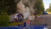Video: State trooper, deputy, bystanders pull woman from burning car