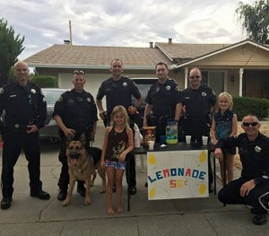 Being able to find (or even create) something positive can help offset all of the negative, like grabbing a refreshing drink of fresh lemonade at this stand.
