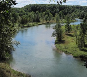 A kayaker was rescued from the Manistee River by North Flight EMS paramedics after his kayak flipped, leaving him clinging to a log.