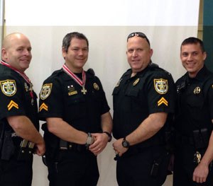 Pictured above, from left to right: Investigator Steve Hough, Investigator Todd Watkins, Investigator. John Merchant, and Investigator Jeff McGill. (PoliceOne Image) 