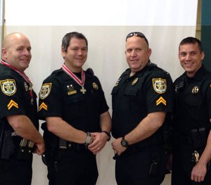 Pictured above, from left to right: Investigator Steve Hough, Investigator Todd Watkins, Investigator. John Merchant, and Investigator Jeff McGill. (PoliceOne Image)