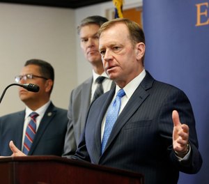 McGregor Scott, the United States Attorney for the Eastern District of California, answers questions concerning the charges against leaders of the white supremacist prison gang, the Aryan Brotherhood, during a news conference in Sacramento