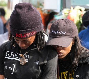 Fans of rapper Nipsey Hussle gathered at a makeshift memorial after the rapper was killed in a shooting outside his clothing store.