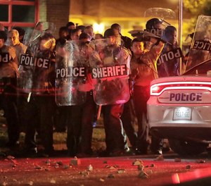 Shelby County Sheriff's deputies brace against the crowd as protesters take to the streets. (Jim Weber/Daily Memphian via AP)